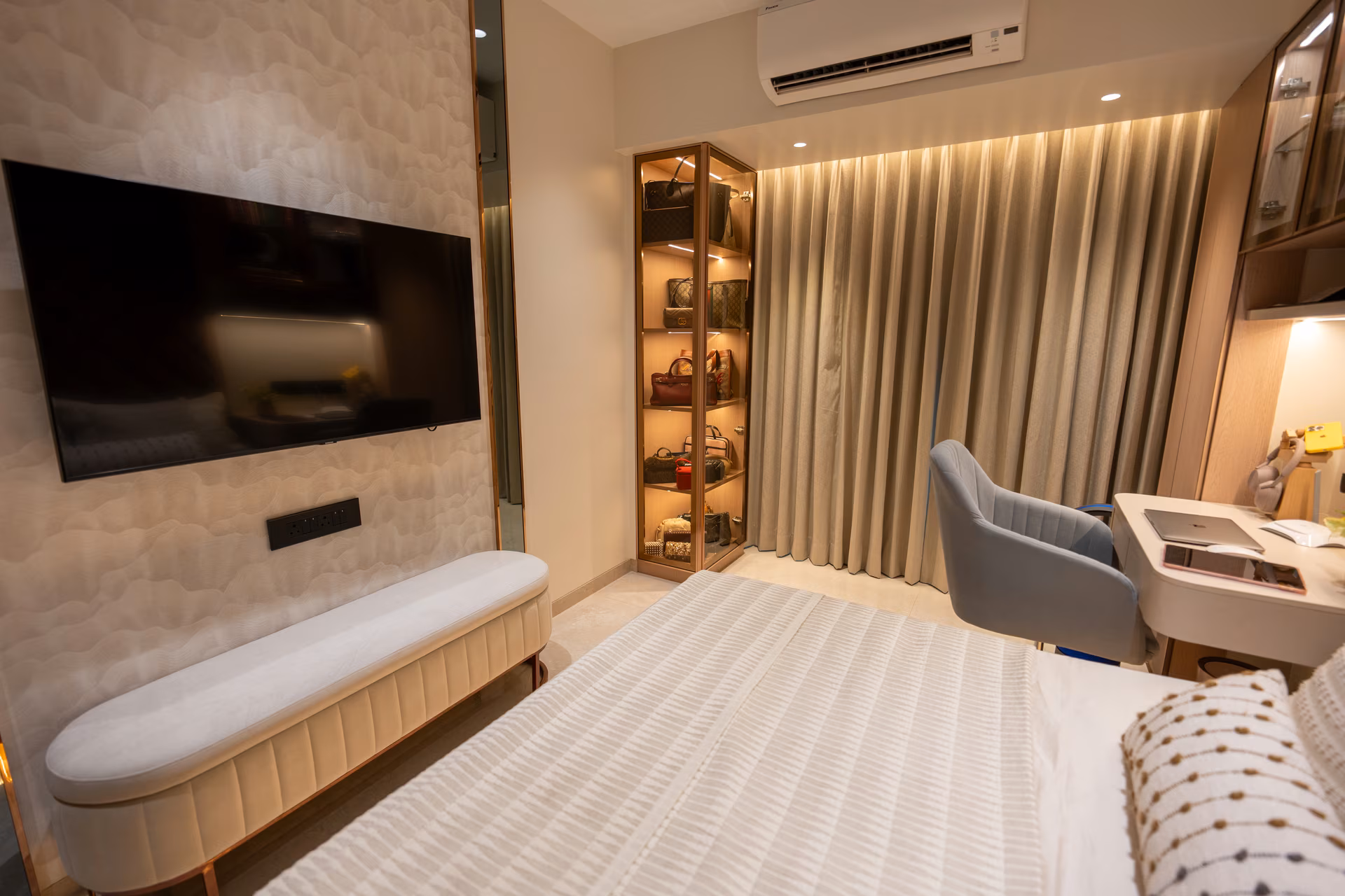 Customized TV unit with integrated storage bench and glass display cabinet by ASK Design and Build