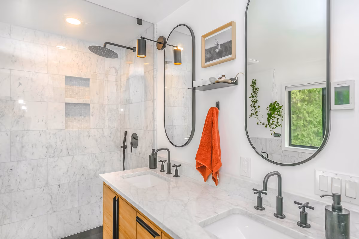 Industrial style bathroom with concrete walls, matte black fixtures, and warm wood accents