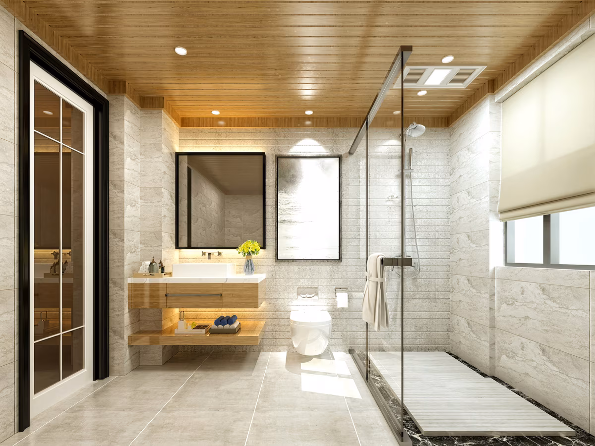 Modern bathroom featuring wooden plank ceiling, floating vanity, and glass shower enclosure with marble-effect walls