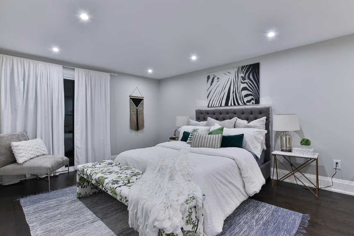 Contemporary bedroom with botanical elements and emerald accents