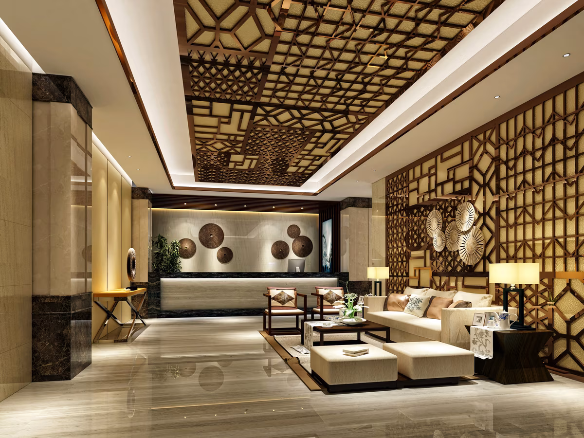 Luxurious oriental lobby with plush seating, decorative ceiling, and warm lighting