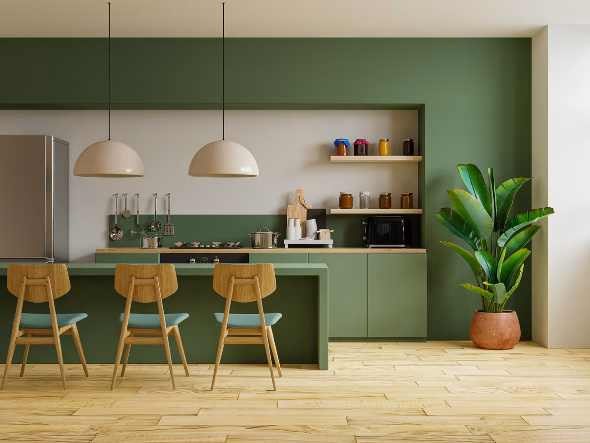 Modern sage green kitchen with wooden accents and contemporary pendant lighting