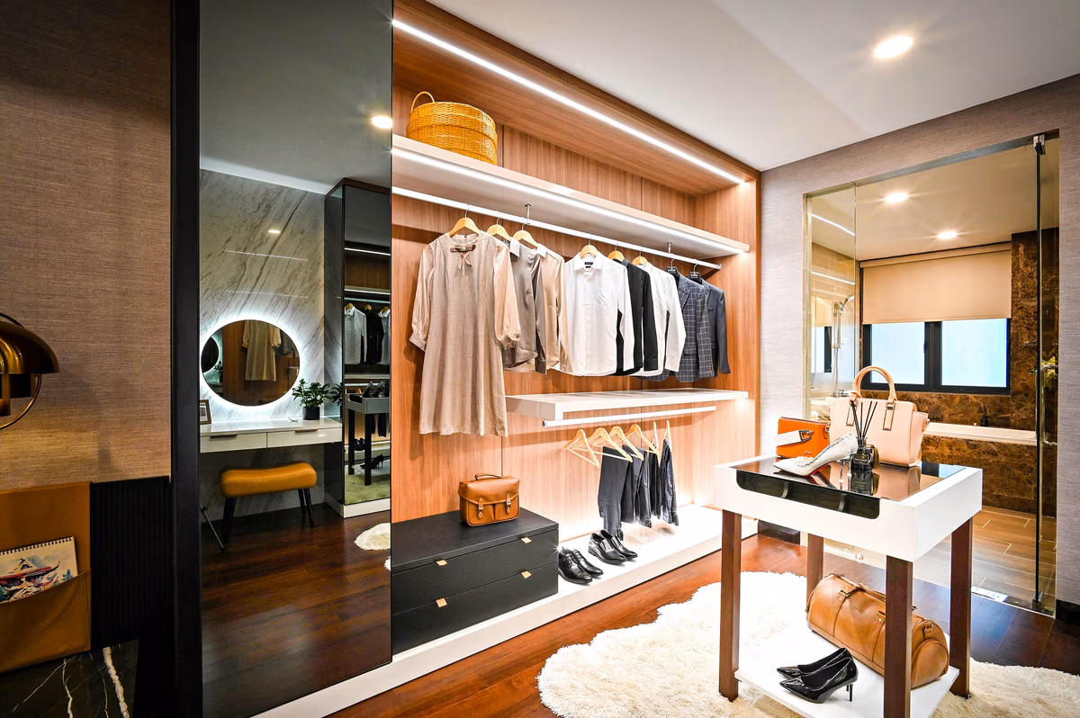 Luxury walk-in closet with LED lighting and wood paneling