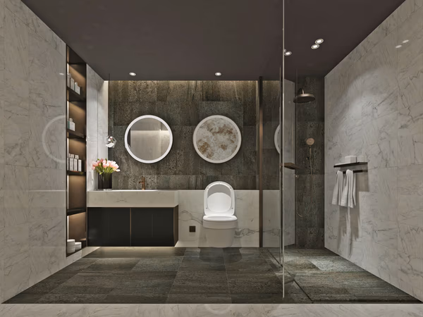 Modern bathroom with contrasting dark and light surfaces, circular mirrors, and built-in illuminated storage