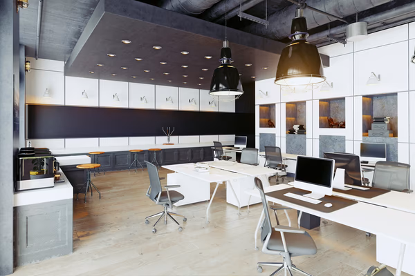 Contemporary office with modular desks, ergonomic chairs, and industrial lighting