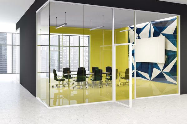 Vibrant glass meeting room with colorful walls and modern furniture