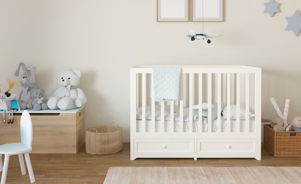 Modern minimalist nursery with star accents and white furniture
