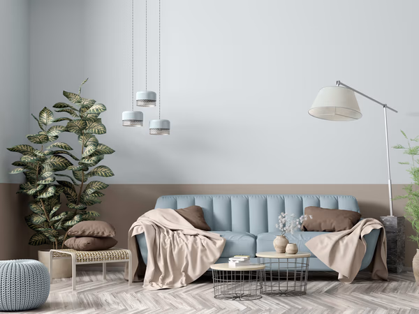 Serene living room with pendant cluster lights and powder blue sofa